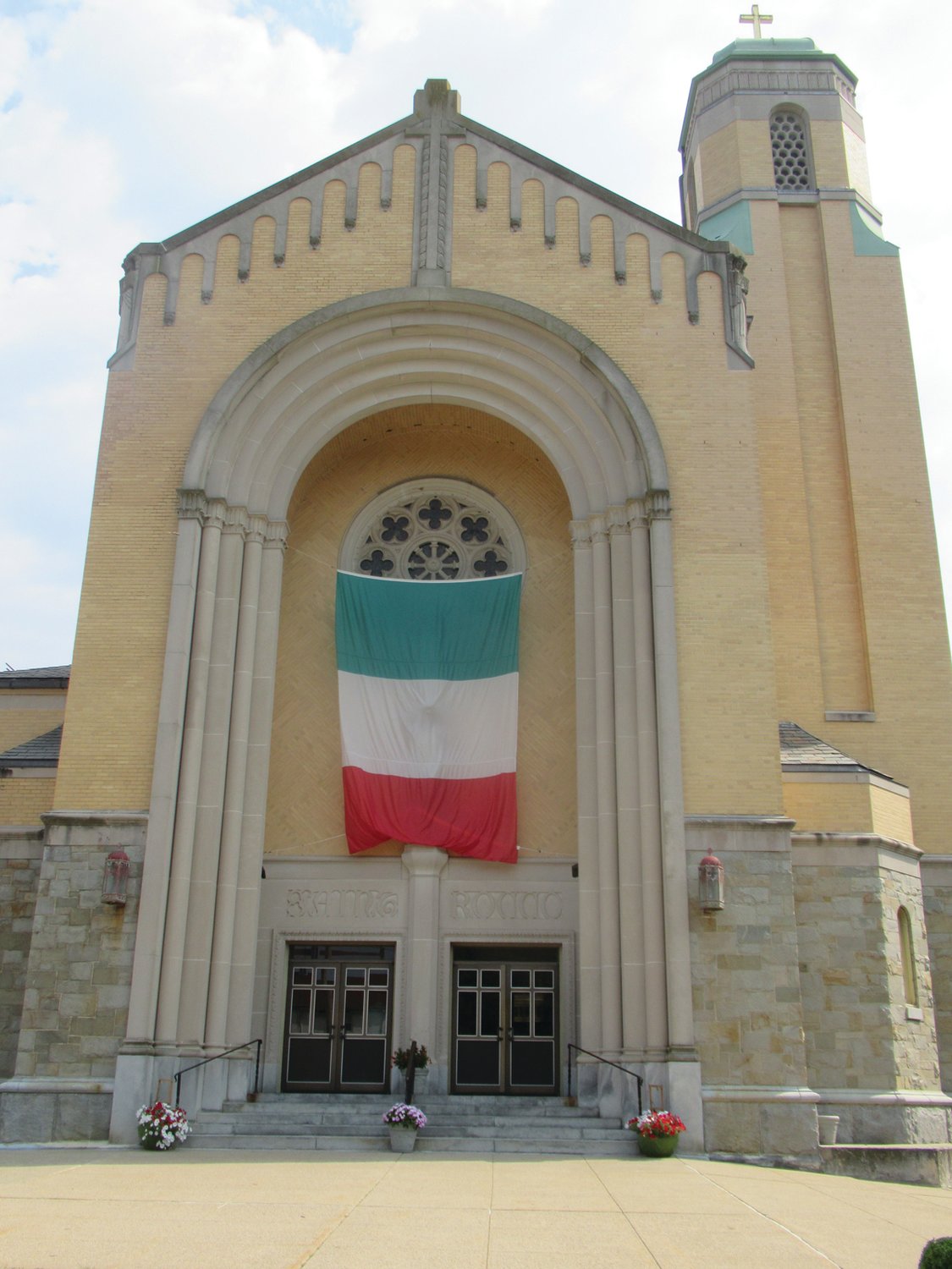 SPECIAL SALUTE: In keeping with the tradition of Saint Rocco’s annual Feast and Festival, this huge Italian flag is hung over the entrance to the church as another example of the classic celebration that will be held from Aug. 12-15 in Johnston.